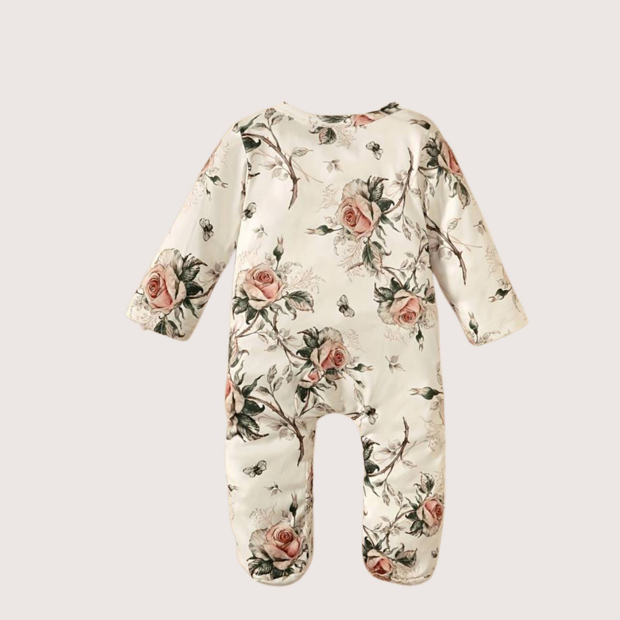 Floral romper with long sleeves, feet, and matching bow headband.