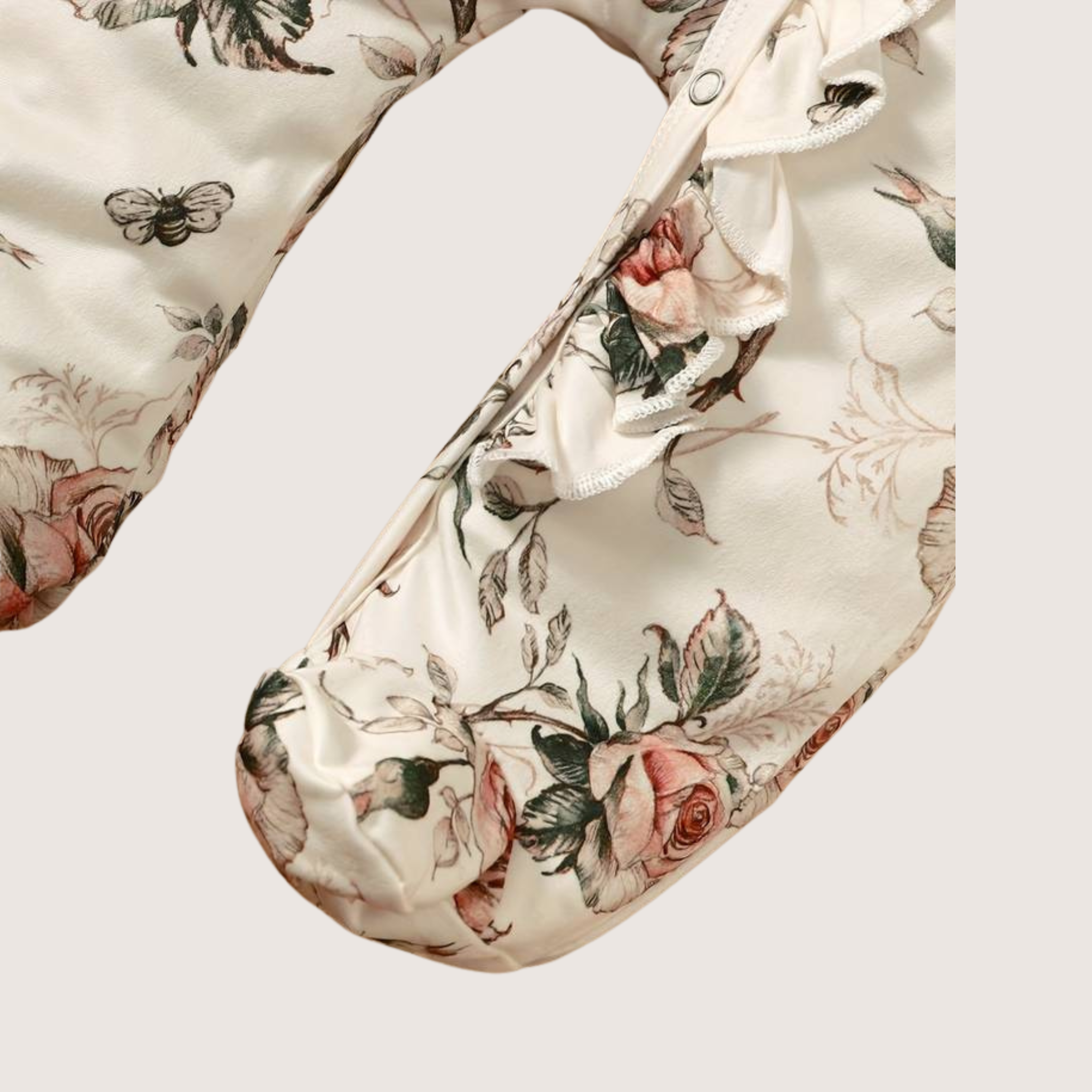 Baby girl romper with covered feet and rose floral pattern