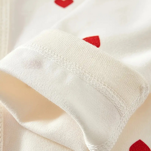 Soft sleeve detail with heart print on newborn baby outfit
